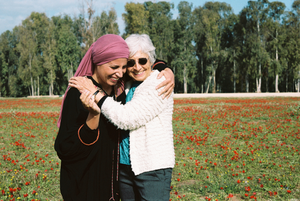 Vivian and Amal in flower field.