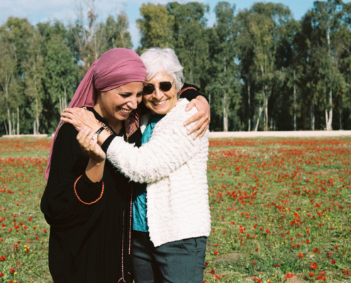 Vivian and Amal in flower field.